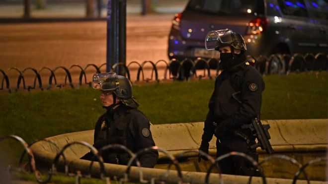 Police officers secure the area after a gunman opened fire on the Champs-Elysees in Paris, 20 April 2017