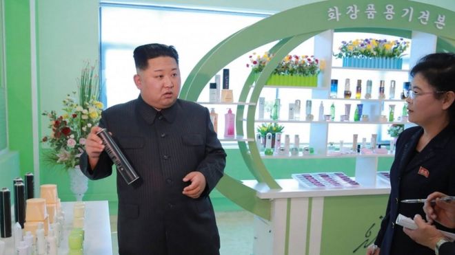 Kim Jong Un holds a hairspray can
