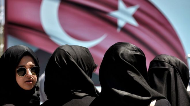 A woman looks on during a demonstration in support of Turkey's President Erdogan (not pictured) at the Sarachane park in Istanbul on July 19, 2016.