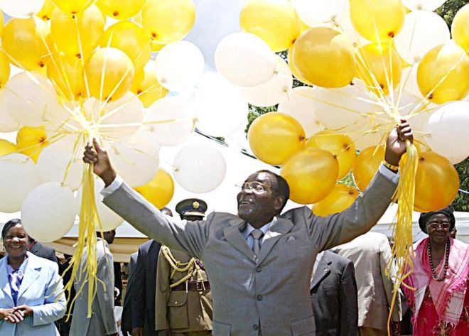 Zimbabwe's veteran leader Robert Mugabe holds 83 balloons in front of relatives and friends at his official residence in Harare, Zimbabwe - 21 February 2007