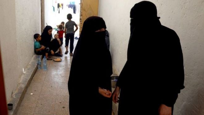 Women whose family members are accused of being IS militants at a camp in northern Syria in July 2017