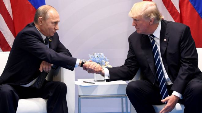 US President Donald Trump and Russian President Vladimir Putin shake hands during a meeting on the sidelines of the G20 Summit in Hamburg, Germany. July 7, 2017