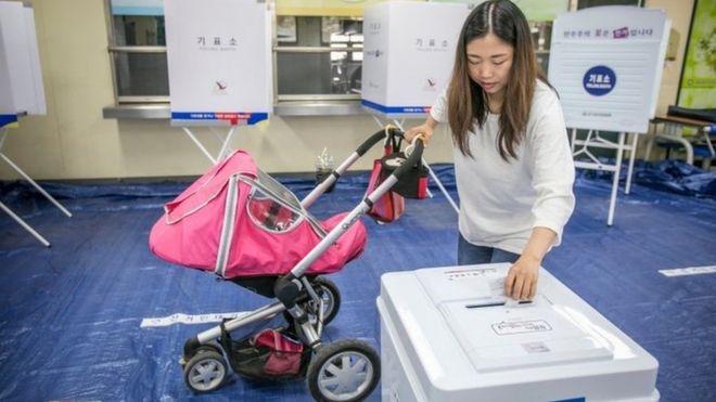 A woman casts her ballot in South Korean presidential elections