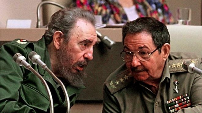 In this file picture taken on December 20, 1999 Cuban President Fidel Castro (L) confers with his brother Raul Castro, Minister of the Cuban Armed Forces, during a session of the Cuban National Assembly, in Havana