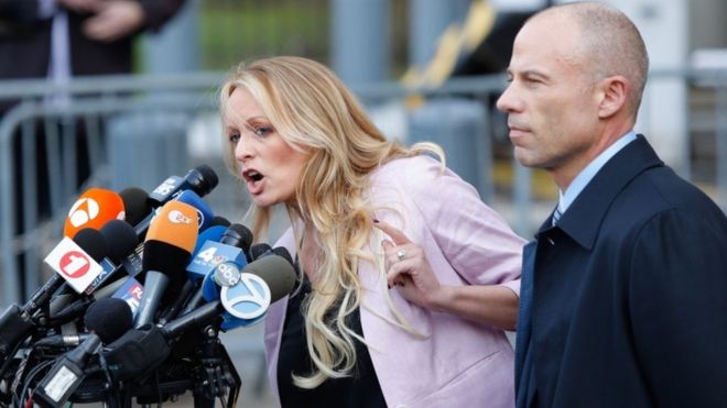 Stormy Daniels, seen here with her lawyer Michael Avenatti, outside a federal court in Manhattan talking to reporters