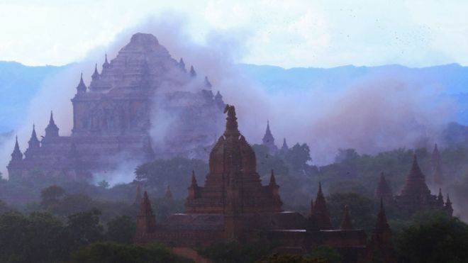 A temple is seen shrouded in dust as a 6.8 magnitude earthquake hit Bagan, 24 August 2016.