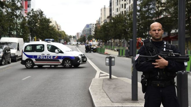 A police officer stands guard in a secured street in Villejuif, a suburb of Paris, on September 6, 2017