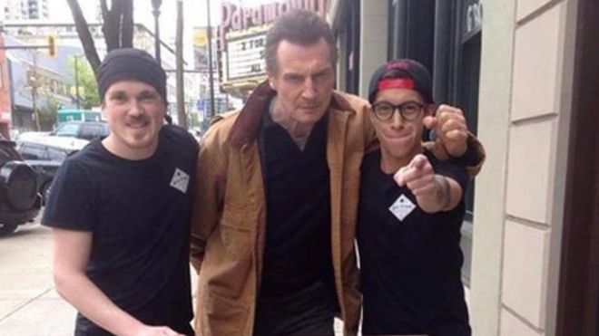 Liam Neeson with staff of the Big Star Sandwich Company in Vancouver