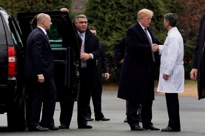 Donald Trump shakes hands with Dr Ronny Jackson after his annual physical exam at Walter Reed National Military Medical Center in Bethesda, Maryland, 12 January 2018