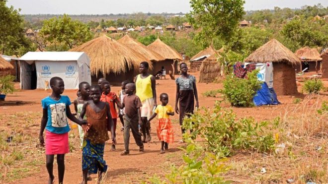Refugee children from South Sudan walk in Bidibidi resettlement camp in the Northern District of Yumbe on April 14, 2017.