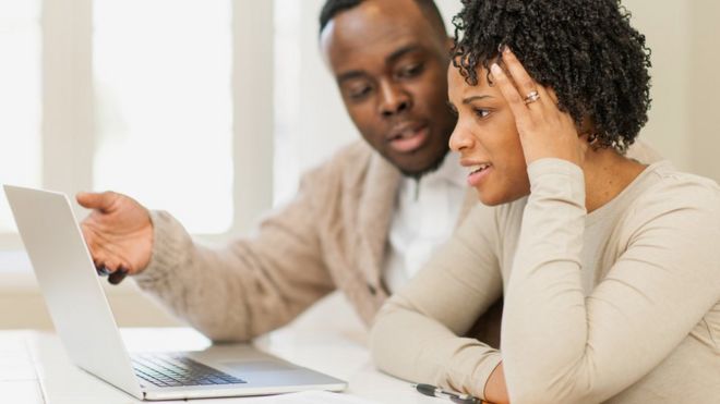 Young couple looking at laptop