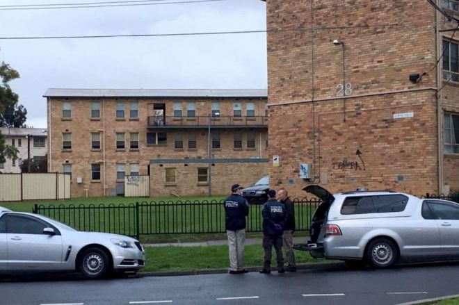 Police officers outside apartments in Melbourne's northern suburbs