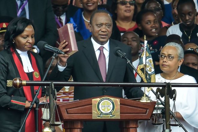 Uhuru Kenyatta in the Nairobi stadium, 28 November Mr Kenyatta will be serving his second term as president