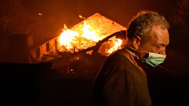 A man fights with a forest fire in the village of Adica in Tondela, Center of Portugal, 16 October 2017