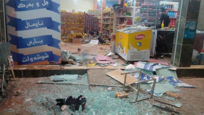 A damaged storefront is seen after an earthquake in Halabja, Iraq