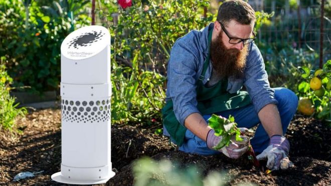 Man gardening next to WaterSeer water condenser