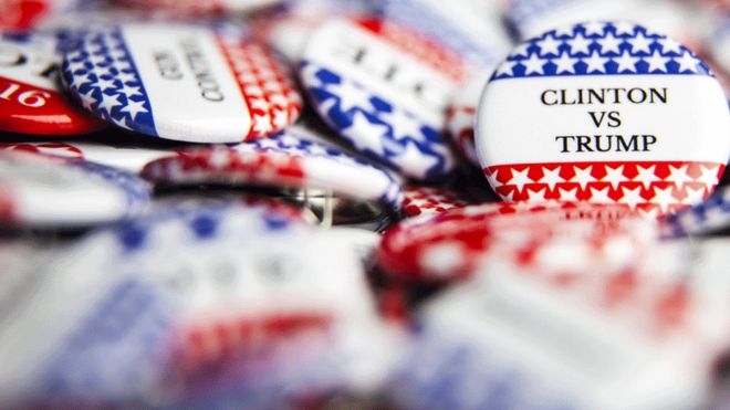 Badges saying Clinton v Trump