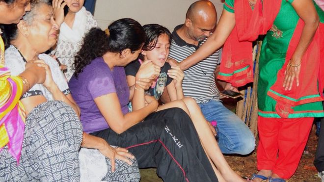 Family members and relatives of 55-year-old Gauri Lankesh, who was shot dead by unknown assailants in the porch of her home in Bangalore mourn her death overnight