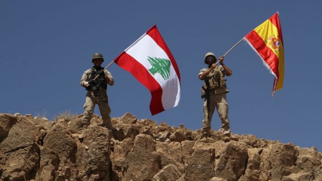 Handout from the Lebanese army shows troops waving both the Lebanese and Spanish flags in the territory of Ras Baalbek