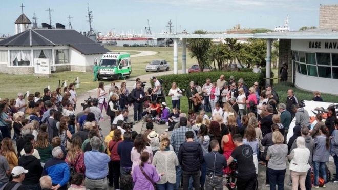 People pray outside Argentina's Navy base in Mar del Plata, on the Atlantic coast south of Buenos Aires, on November 22, 2017, while the search for the missing ARA San Juan submarine keeps going on.