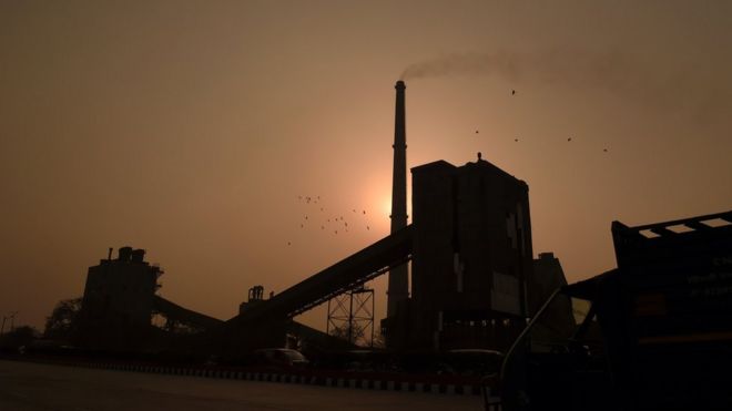 A factory emits smoke in New Delhi, 19 February 2015