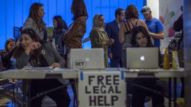 Lawyers offer free legal help to arriving international travellers at Los Angeles International Airport on June 29, 2017 in Los Angeles, California