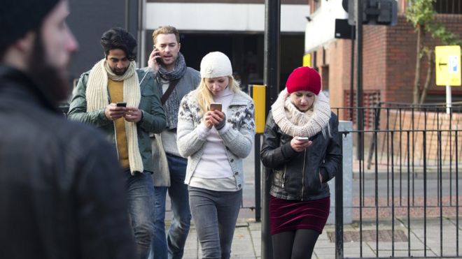 Image result for pics of people on their phones crossing the road