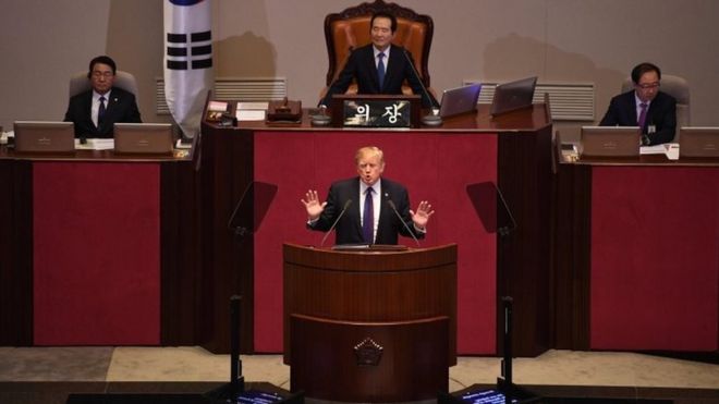US President Donald Trump (C) addresses the National Assembly in Seoul on November 8, 2017.