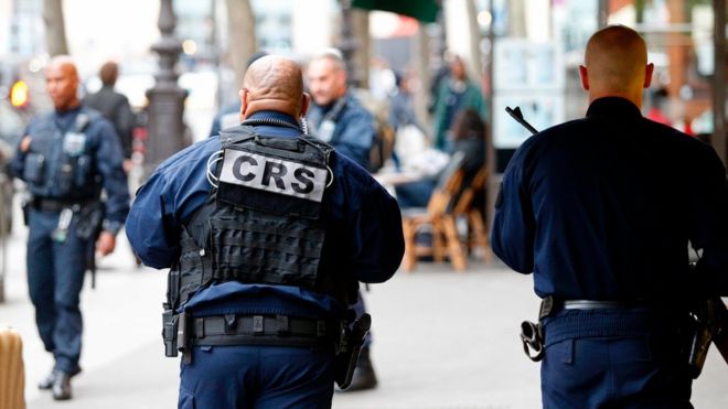 Police officers patrol in Paris