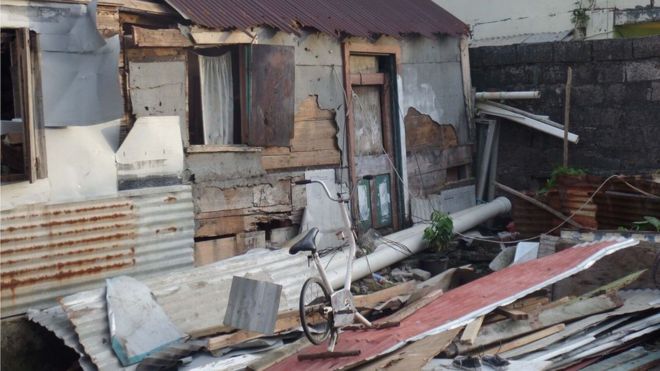 An exercise bike is the only thing left sanding in this destroyed home in Soufriere.