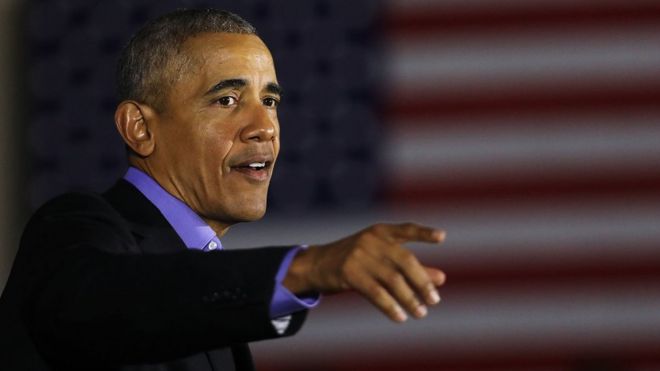 Former US President Barack Obama speaks during a campaign rally in Newark, New Jersey on 19 October