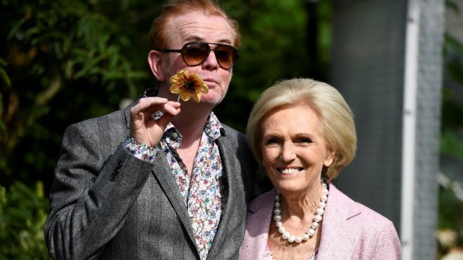 Television presenters Chris Evans and Mary Berry pose for pictures