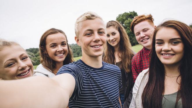 Group of adolescents posing for a selfie