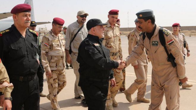 Twitter image of Haider al-Abadi shaking hands with Iraqi fighters