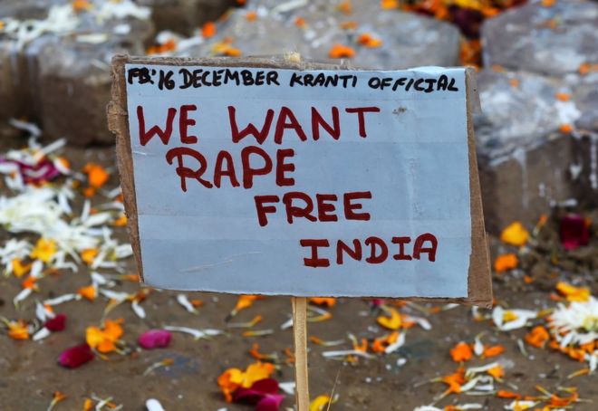 A placard calling for a rape-free India is pictured beside a memorial in Jantar Mantar, Delhi on December 16, 2014