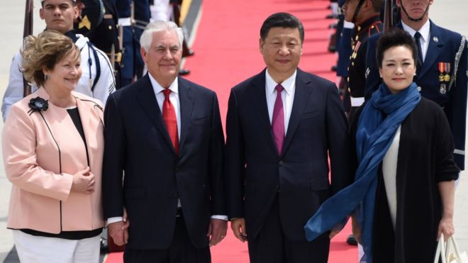 US Secretary of State Rex Tillerson (2nd L) and his wife Renda St. Clair (L) greet the President of the People"s Republic of China Xi Jinping (2nd R)and his wife Peng Liyuan (R) as they arrive to Palm Beach International Airport on Thursday, April 6, 2017 in West Palm Beach, Fla.