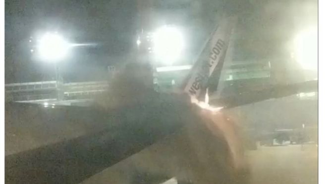 Passenger photo shows fire on Sunwing plane's tail