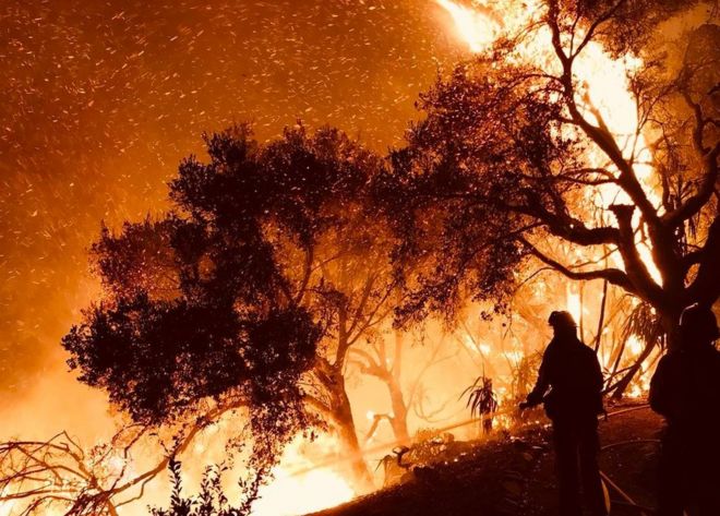 Firefighters knock down flames as they advance on homes in Carpinteria