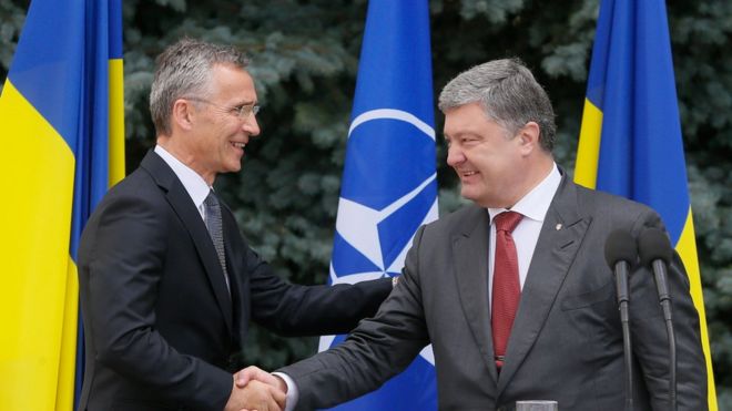 Ukrainian President Petro Poroshenko and Jens Stoltenberg, the Secretary General of Nato, shake hands after a joint news conference following their meeting in Kiev