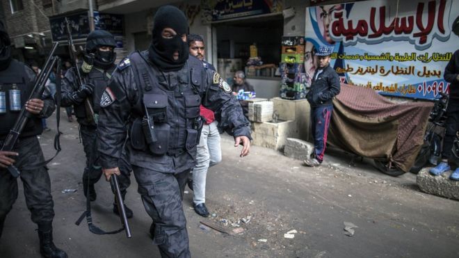 Egyptian police special forces patrol streets in al-Haram district of Giza on 25 January 2016