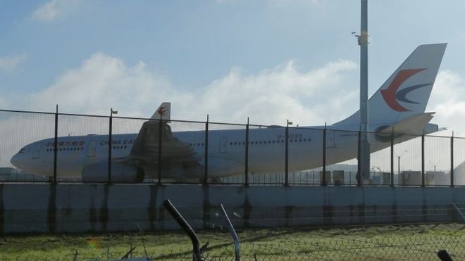 A China Eastern Airlines Airbus A330 aircraft sits on the tarmac at Sydney International Airport in Australia, June 12, 2017, after it made an emergency landing with a damaged left engine.