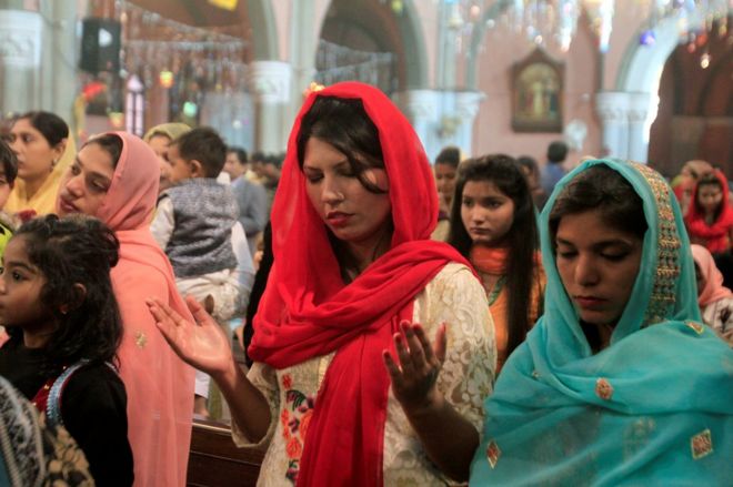 People attend a mass on Christmas day at the Cathedral Church in Lahore, Pakistan December 25, 2017