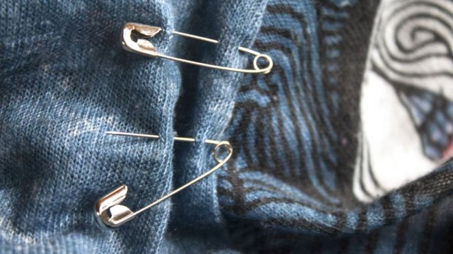 Safety pins on a blouse