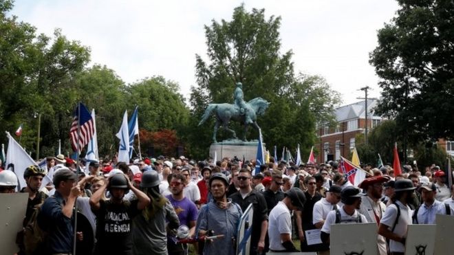 Far-right protesters converge around the statue of a Southern general