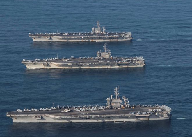The aircraft carriers USS Ronald Reagan (CVN 76), USS Theodore Roosevelt (CVN 71) and USS Nimitz (CVN 68) in the western Pacific, 12 November 2017