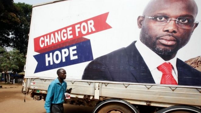 Election poster for George Weah in Monrovia, Liberia December 27, 2017