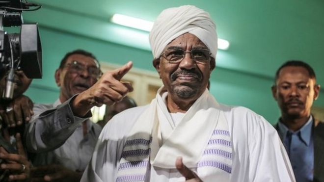President Omar al-Bashir prepares to cast his ballot as he runs for another term in Khartoum, Sudan, 13 April 2015