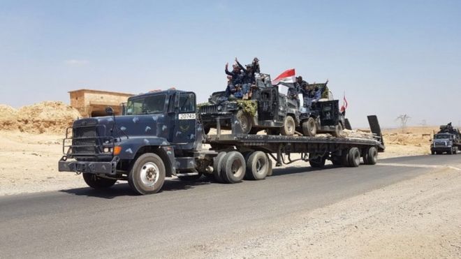 Iraqi armoured vehicles are transported to the frontline outside Tal Afar (15 August 2017