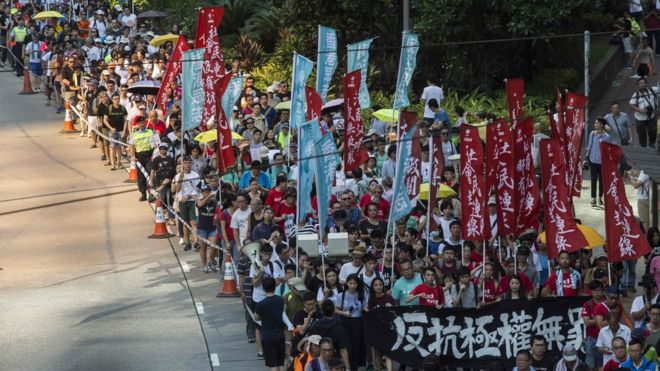 Protesters march in Hong Kong on August 20, 2017