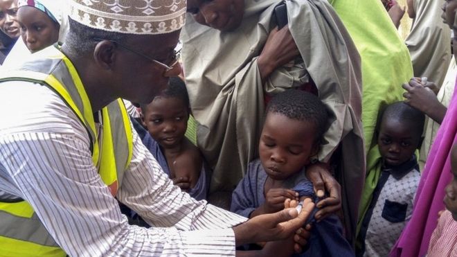 Nigerian Doctor Rilwanu Mohammed (L) Executive Secretary of the Federal capital Primary Health Care Development Board vaccinates a resident for Meningitis in Dakwa village, Bwari, Nigeria, 04 April 2017